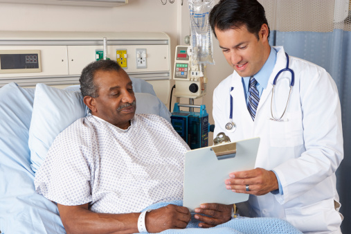 Doctor Explaining Consent Form To Senior Patient