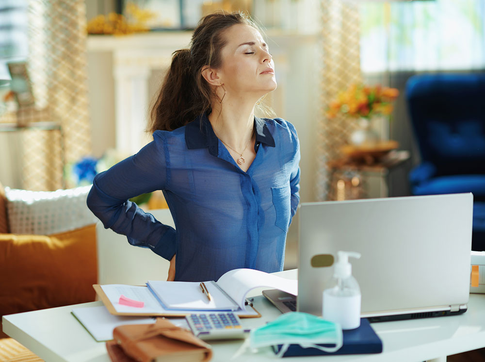 Woman experiencing back pain